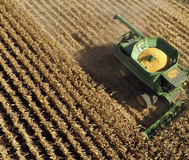 Non-GMO corn is harvested with a John Deere & Co. 9670 STS combine harvester in this aerial photograph taken above Malden, Illinois, U.S., on Wednesday, Sept. 30, 2015. Corn exports by the U.S., the biggest producer, are running 28 percent behind last year's pace as a stronger dollar entices buyers to go elsewhere for cheaper supply. Photographer: Daniel Acker/Bloomberg