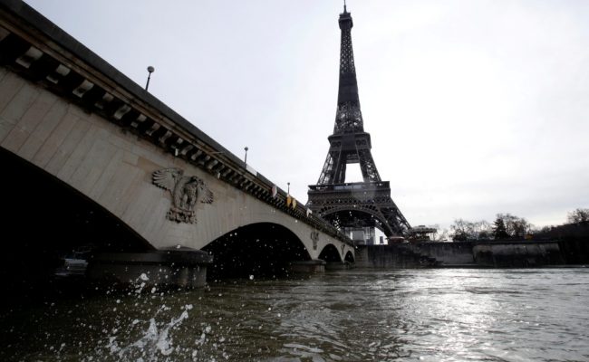 FILE PHOTO: A view shows the Eiffel Tower and the flooded banks of the River Seine in Paris and as water levels remains very high above the normal level of the river, France, February 12, 2021. REUTERS/Gonzalo Fuentes/File Photo